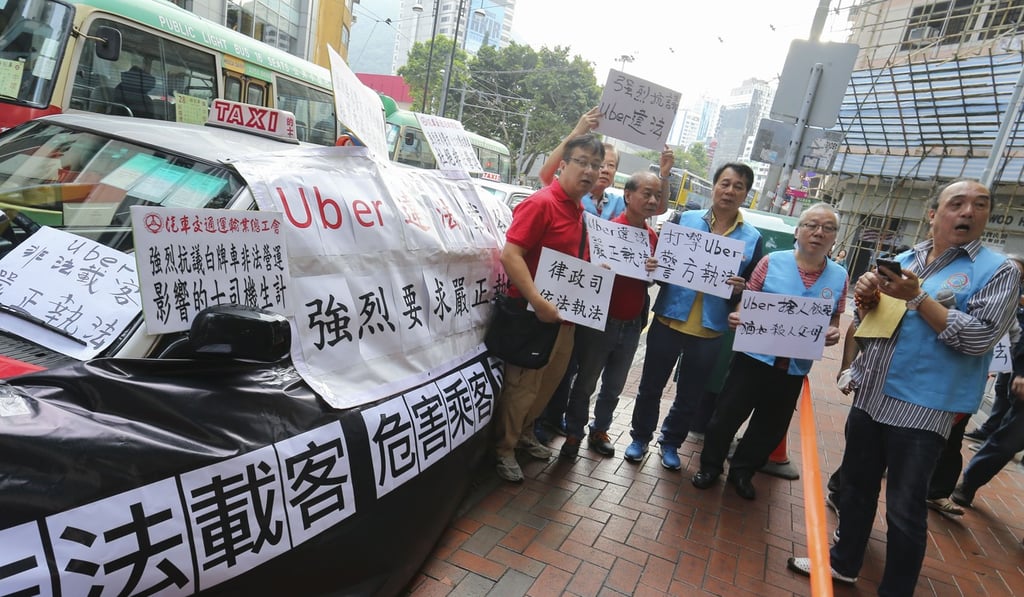 Hong Kong taxi drivers hold a protest outside the Uber headquarters in November 2017. Photo: Dickson Lee