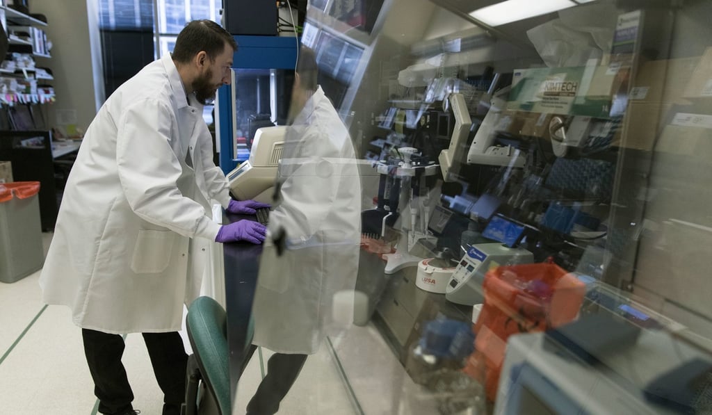 Biologist Jason Plyler prepares to test how immune cells react to possible flu vaccines at the Vaccine Research Centre at the US National Institutes of Health in Bethesda, Maryland. Photo: AP