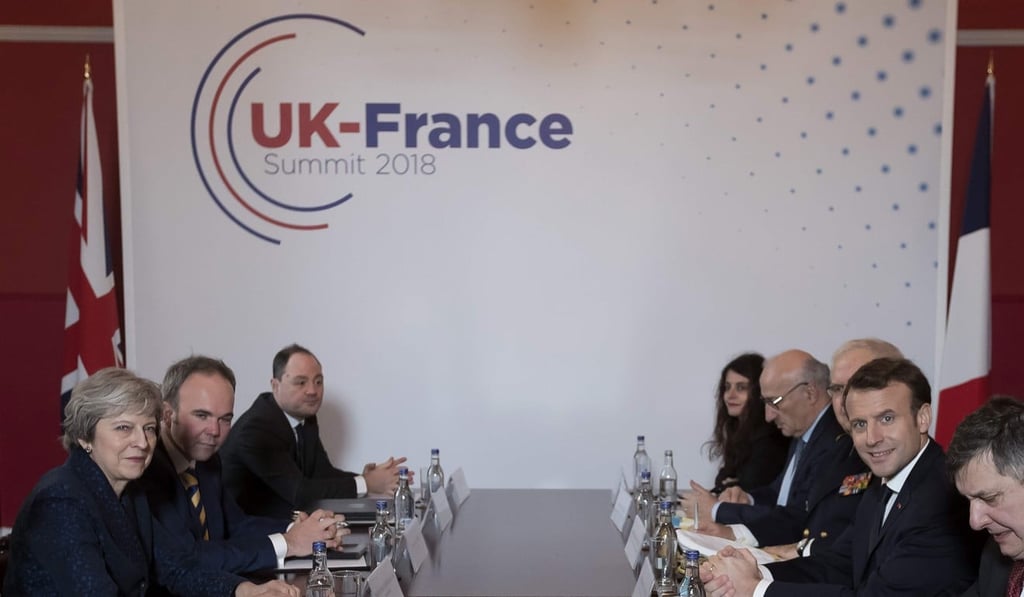 FThe British and French leaders and their teams meet for their discussion. Britain has agreed to pay £44.5 million (US$62 million, HK$50 million) to boost security at the French ports that immigrants use to enter Britain illegally. Previously, this was borne entirely by France. Photo: AFP/Pool