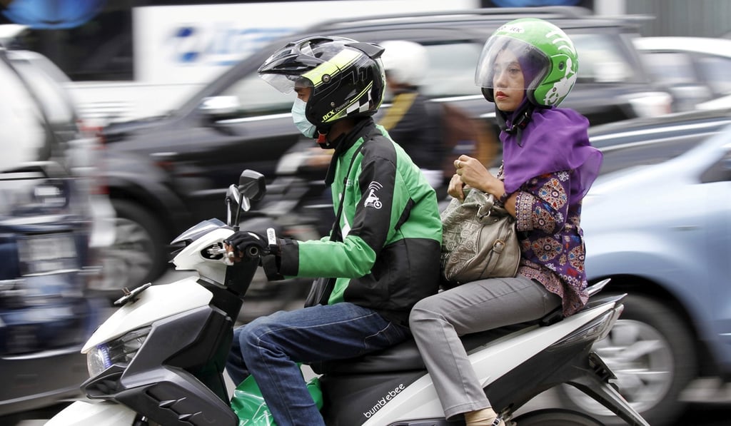 Ride-hailing apps, such as Go-Jek in Indonesia, are examples of service sectors that have sprung up recently thanks to technology. Photo: Reuters