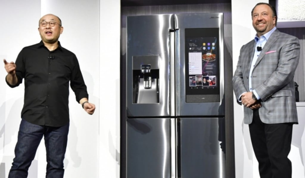 Lee Yoon (left), senior vice-president of Samsung Electronics America, and Joe Stinziano, executive vice-president of Samsung Electronics America, reveal the next generation of Family Hub connected refrigerators with voice control.