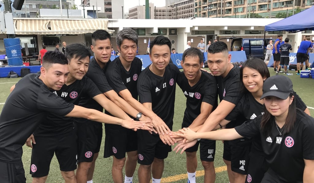 Szeto (C), new boss Lee Kin-ho (fourth from right) and former coach Chan Yuen-ting (second from right) pose with the rest of the Eastern staff. Photo: Chan Kin-wa