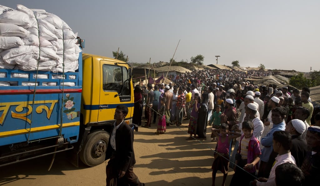 Rohingya refugees outside a food distribution centre at Kutupalong refugee camp. Photo: AP Rohingya refugees outside a food distribution centre at Kutupalong refugee camp. Photo: AP
