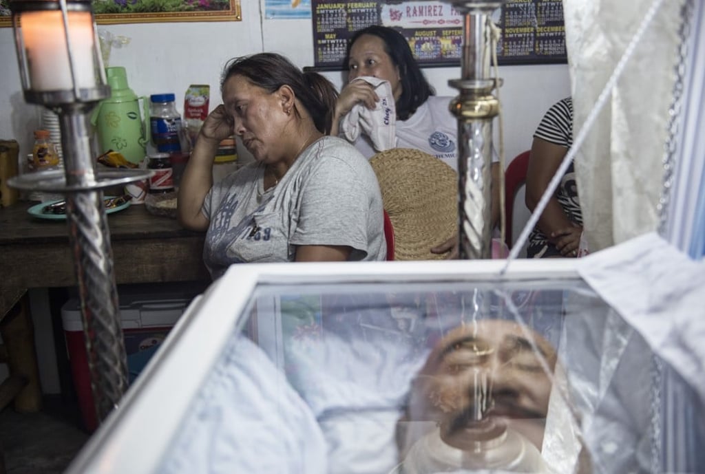 Victoria Ramirez at the wake of her husband, Carlito, who was killed on December 11 last year, a week after the couple’s only daughter and her husband had been gunned down in the same way.