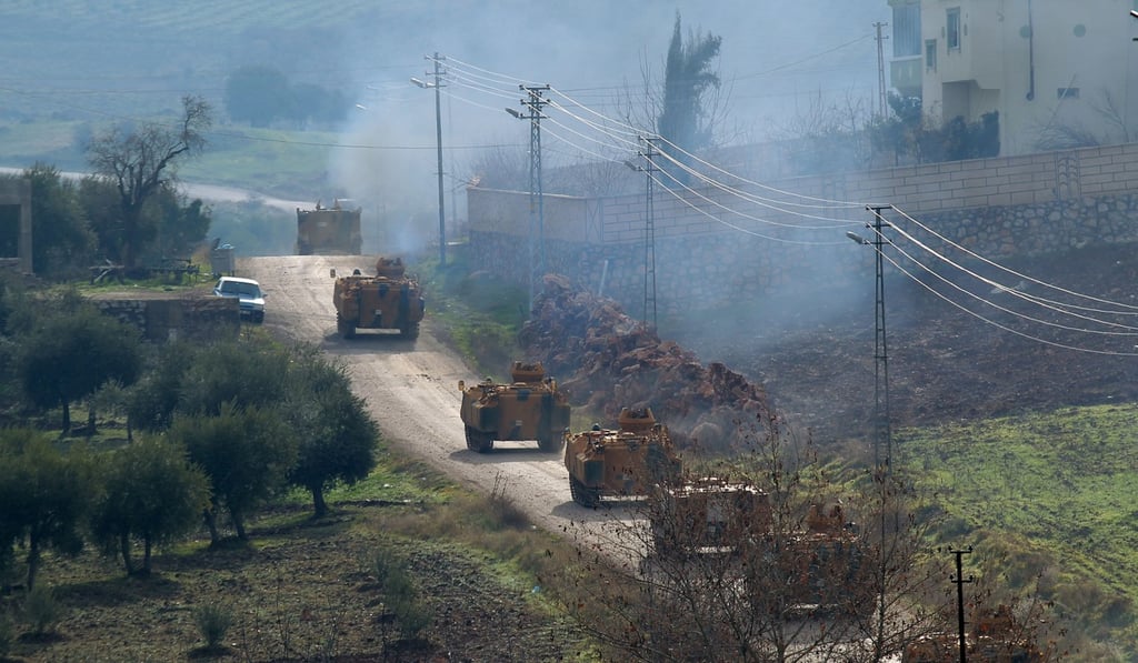 Turkish military vehicles arrive at a border village near the town of Hassa in Hatay province, Turkey. Photo: Reuters