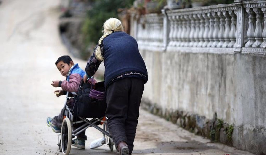 Shi Yuying is the main carer for her grandson Jiang Haowen. Photo: Kaixian.tv