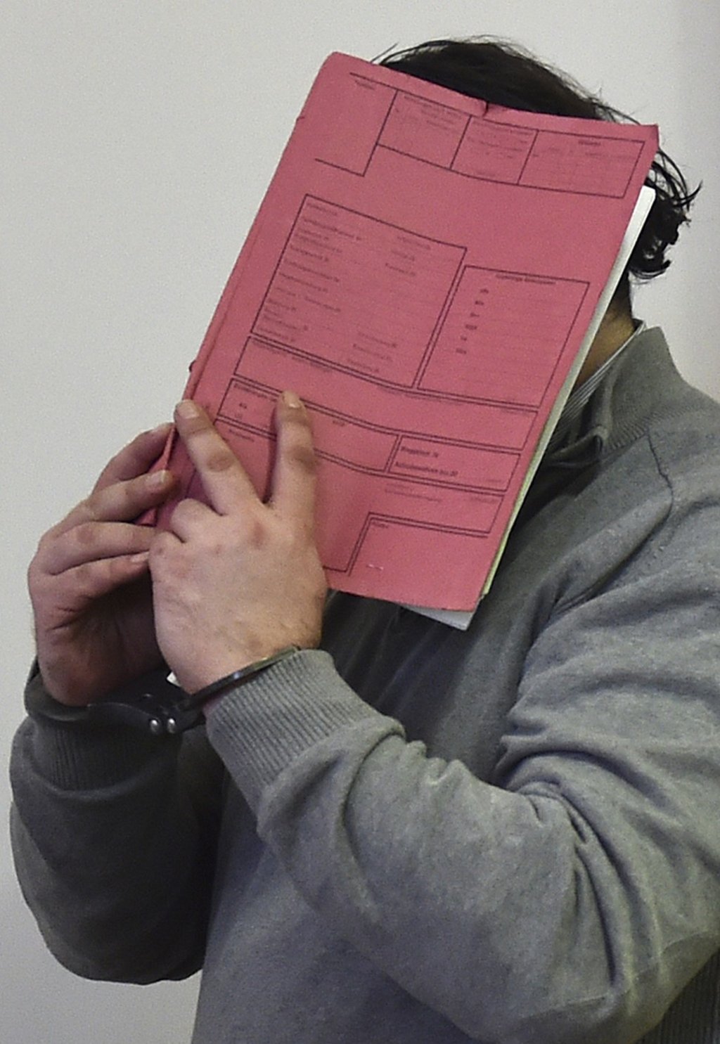 In this February 26, 2015 file photo, former nurse Niels Hoegel covers his face with a file at the district court in Oldenburg, Germany. Prosecutors in Oldenburg said on January 22, 2018 that they have charged Niels Hoegel with 97 more counts of murder. Photo: DPA via AP In this February 26, 2015 file photo, former nurse Niels Hoegel covers his face with a file at the district court in Oldenburg, Germany. Prosecutors in Oldenburg said on January 22, 2018 that they have charged Niels Hoegel with 97 more counts of murder. Photo: DPA via AP