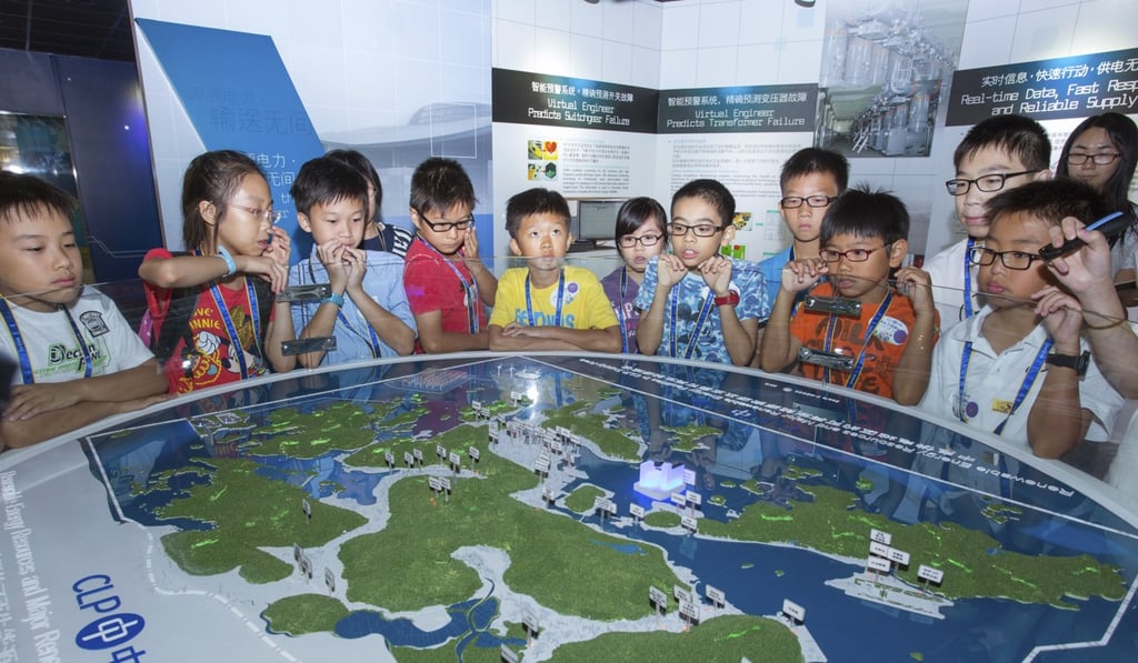 Students learning about the development of future electricity technologies at the CLP Centre in Sham Shui Po. Better access to data from Hong Kong’s two private electricity companies would enable the government to plan more sustainably. Photo: CLP