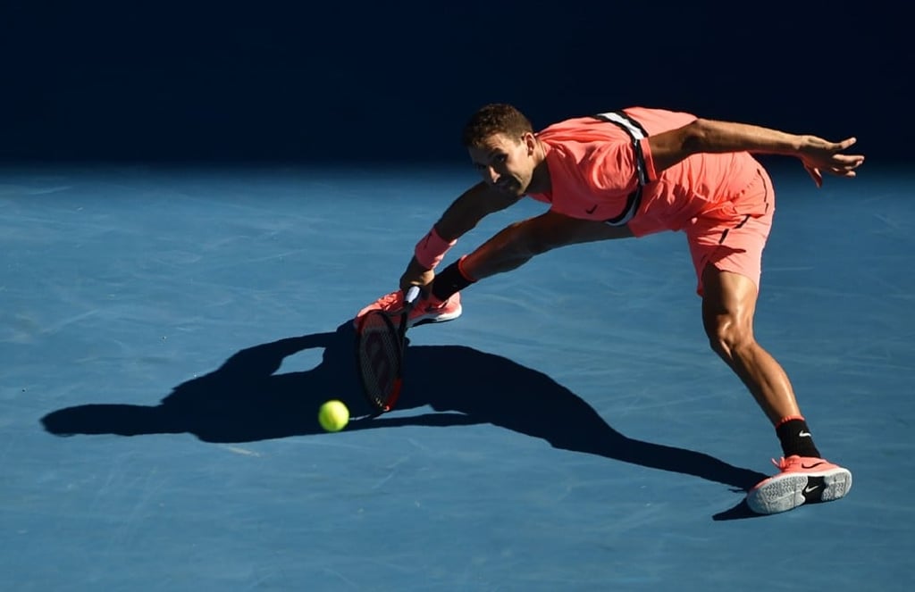 Dimitrov plays a forehand return to Edmund. Photo: AFP