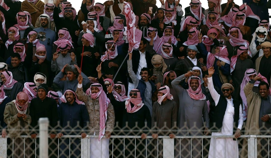 Saudi men cheer during King Abdulaziz Camel Festival. Photo: Reuters