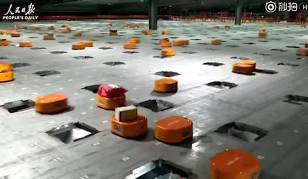 The army of little orange Hikvision robots in the sorting centre of Chinese delivery powerhouse, Shentong (STO) Express’ delivery warehouse in Hangzhou, Zhejiang province. Photo: Handout
