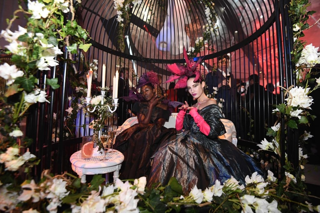 Women pose at the Dior Ball at the Hotel Peyrenc de Moras in Paris. Photo: AFP Women pose at the Dior Ball at the Hotel Peyrenc de Moras in Paris. Photo: AFP