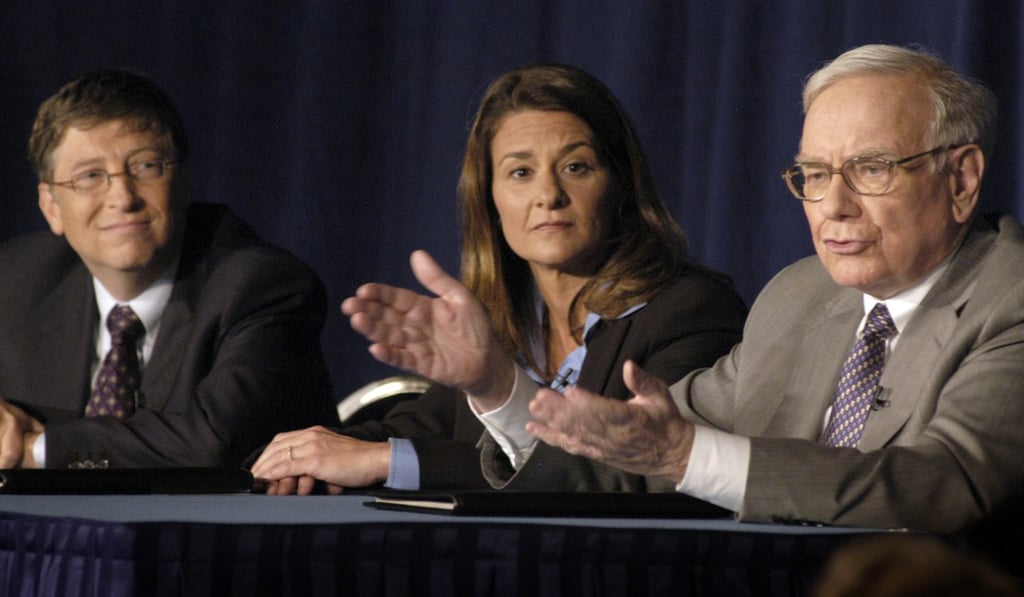 Microsoft co-founder Bill Gates (left) and his wife Melinda listen as US investment guru Warren Buffett (right) talks about his pledge of 10 million class B shares of Berkshire Hathaway Corporation to the Bill & Melinda Gates Foundation in 2006. Gates and Buffet went on to found The Giving Pledge, which encourages the wealthy to dedicate most of their wealth to philanthropic work. Photo: AFP