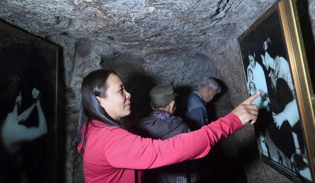 Ho Thi Giu was born inside the Vinh Moc tunnel network. Photo: AFP