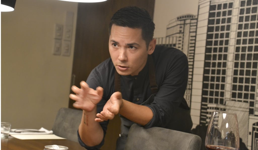Josh Boutwood explains a dish to diners at Test Kitchen in Makati, Manila. Photo: Chris Dwyer