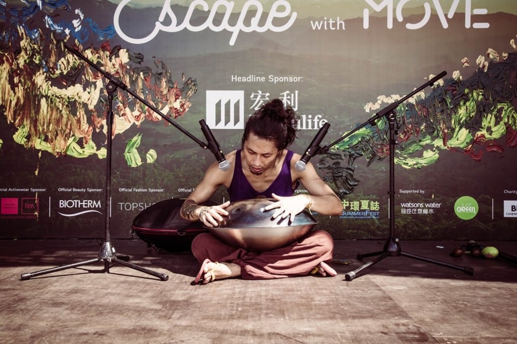 A percussionist promotes the Iris: Your Escape festival.