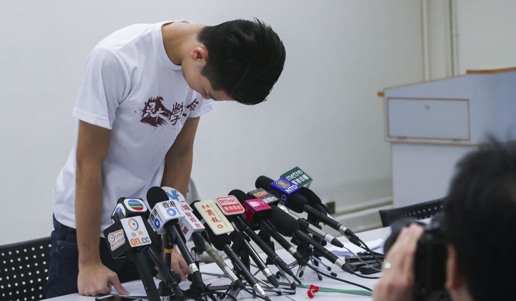 Baptist University student union leader Lau Tsz-kei apologising on Wednesday for his use of foul language during a campus protest, before receiving the suspension news. Photo: Edward Wong