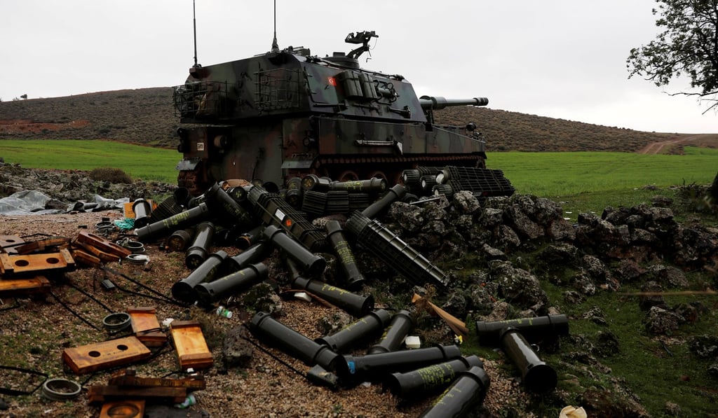 Empty shells are seen next to a Turkish army howitzer on the Turkish-Syrian border in Hatay province, on Tueaday. Photo: Reuters
