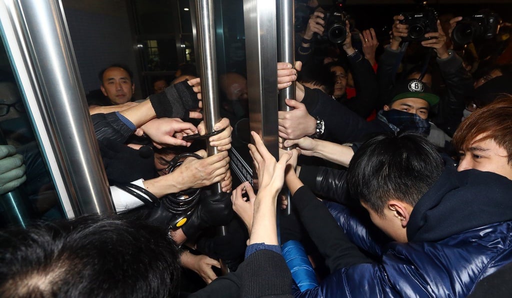 University of Hong Kong students try to break into a meeting of the governing council in January 2016. Photo: Sam Tsang