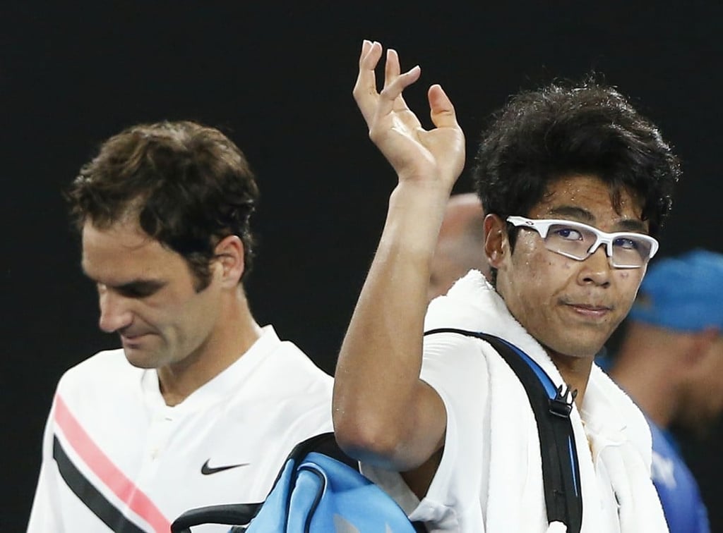 Chung Hyeon waves to the crowd as he leaves after retiring against Roger Federer. Photo: Reuters