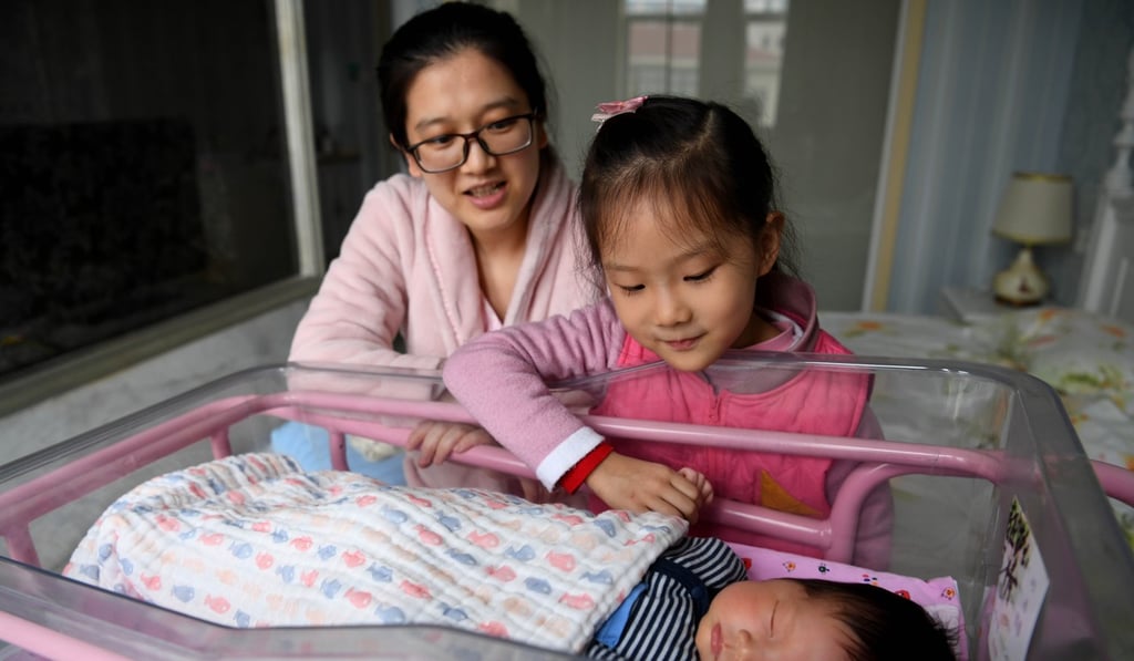 He Xin spends time in a hospital postnatal centre in Hefei, China with her two children in early December. China can begin allowing families more discretion over how many children to have even as it addresses its declining workforce by increasing efficiency and output. Photo: Xinhua