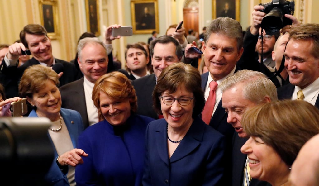 US Senator Susan Collins, centre right, addresses reporters with fellow senators after lawmakers struck a deal to reopen the federal government three days into a shutdown. Photo: Reuters