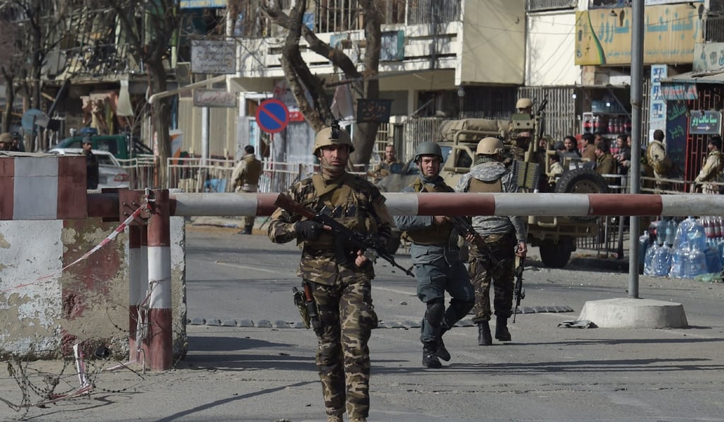 Security personnel at the site of the car bombing. Photo: Agence France-Presse