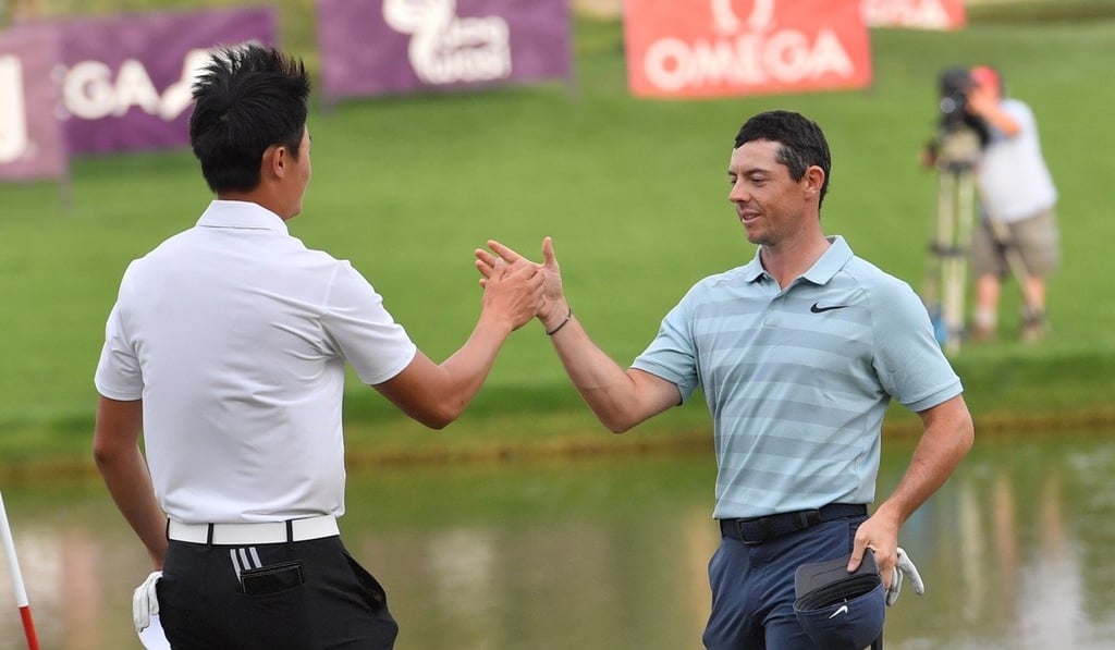 LI Haotong and Rory McIlroy shake hands at the end of the Dubai Desert Classic. Photo: AFP LI Haotong and Rory McIlroy shake hands at the end of the Dubai Desert Classic. Photo: AFP