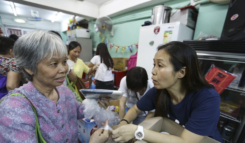 Elli Fu Nga-nei (right), founder of J Life Foundation, set up centres to give away food to the underprivileged in Hong Kong. Government policies could encourage greater transparency and accountability among non-governmental organisations. Photo: Xiaomei Chen
