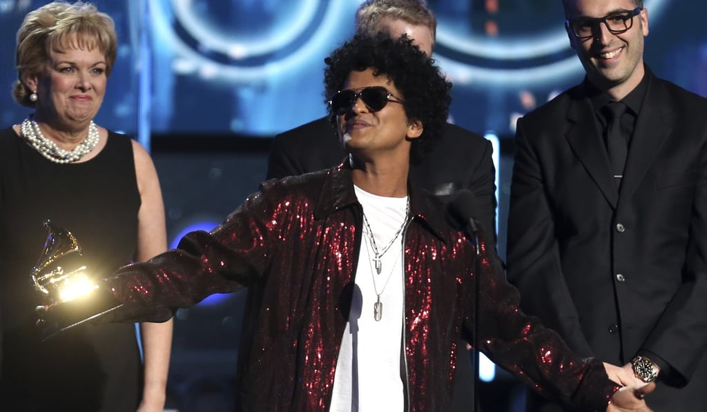 Bruno Mars accepts the award for record of the year for “24K Magic”. Photo: AP