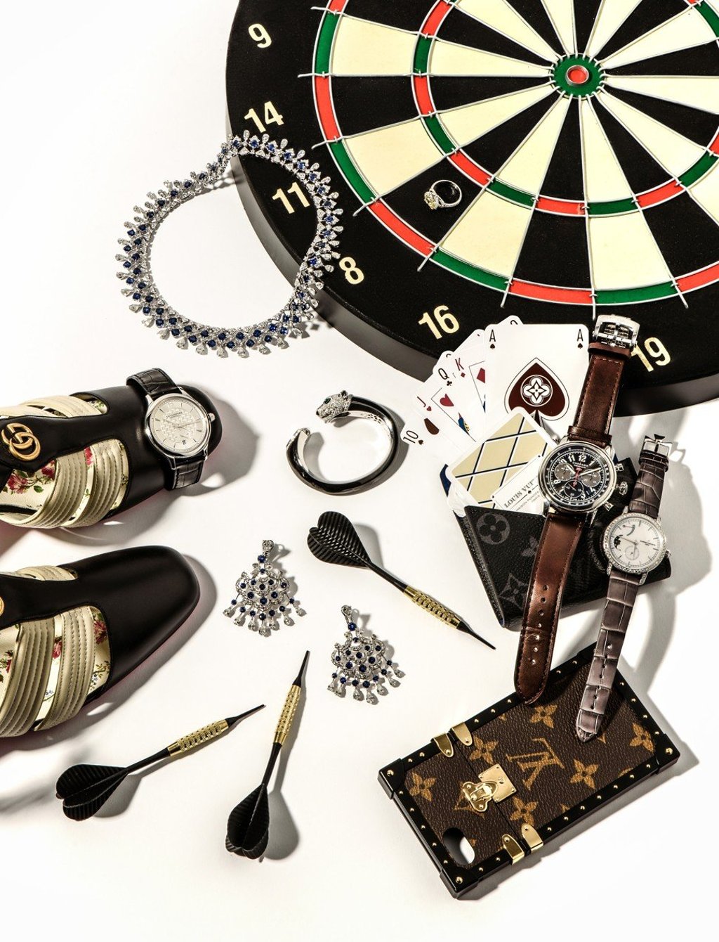 Chopard, necklace in white gold and sapphires, price on request, L.U.C XPS 1860 Officer watch (on shoe) in white gold, HK$220,000, Mille Miglia 2016 XL Race Edition watch with brown straps in stainless steel, HK$77,000; Cartier, Bangle watch in white gold with diamonds, emeralds and onyx, price on request; Graff, Chandelier earrings in sapphire and diamonds, price on request; Vacheron Constantin, Traditionnelle moonphase and power reserve small model watch in white gold with diamonds and mother-of-pearl, HK$324,000; Gucci, shoes, HK$10,300; Louis Vuitton, phone case, HK$19,300, playing cards with pouch, HK$4,000.