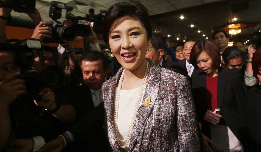 Thailand’s former prime minister Yingluck Shinawatra arrives at parliament in Bangkok, on January 22, 2015. Yingluck fled the country in 2017 to evade a prison sentence after she was convicted of negligence. Photo: AP