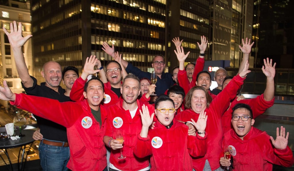 Delegates celebrate Hong Kong securing the 2022 Gay Games. Photo: AFP