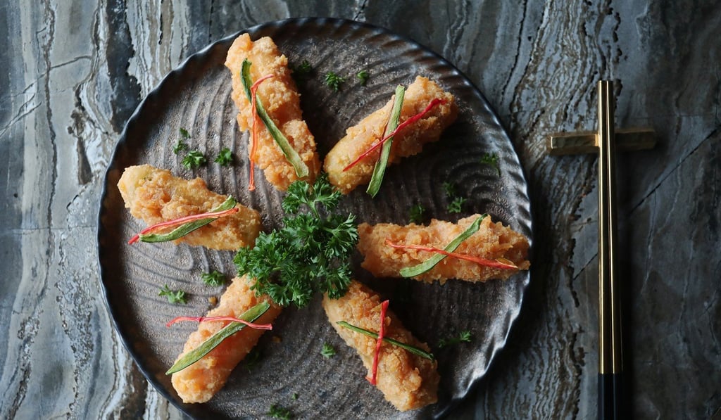 Crispy okra and yam with salted egg yolk sauce. Photo: Jonathan Wong