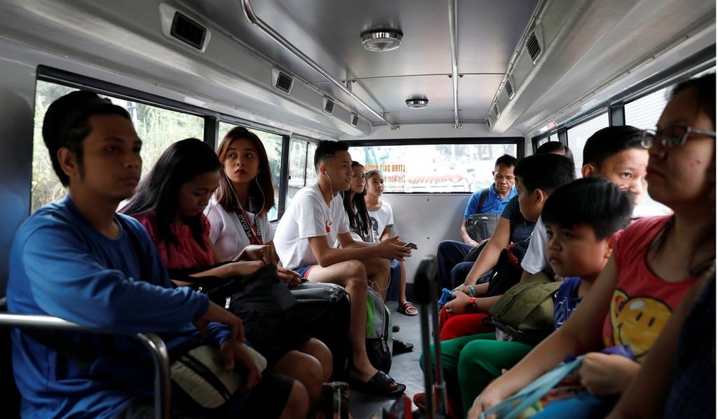 Passengers ride a new jeepney prototype in Marikina City, Metro Manila, the Philippines. Photo: Reuters