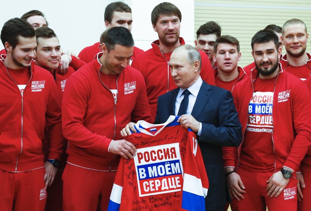 Russian President Vladimir Putin (centre right) with the Russian national ice hockey team during a meeting with the Russian athletes who will take part in the Pyeongchang Winter Olympics in South Korea. Photo: AP Russian President Vladimir Putin (centre right) with the Russian national ice hockey team during a meeting with the Russian athletes who will take part in the Pyeongchang Winter Olympics in South Korea. Photo: AP