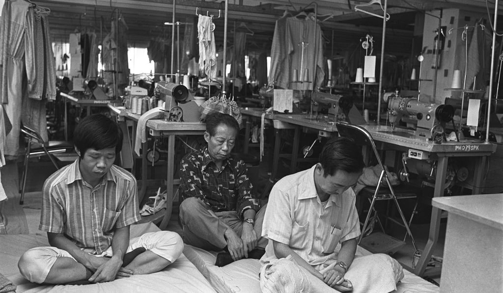 Garment factory workers practise yoga at their factory during a lunch break. Picture: SCMP