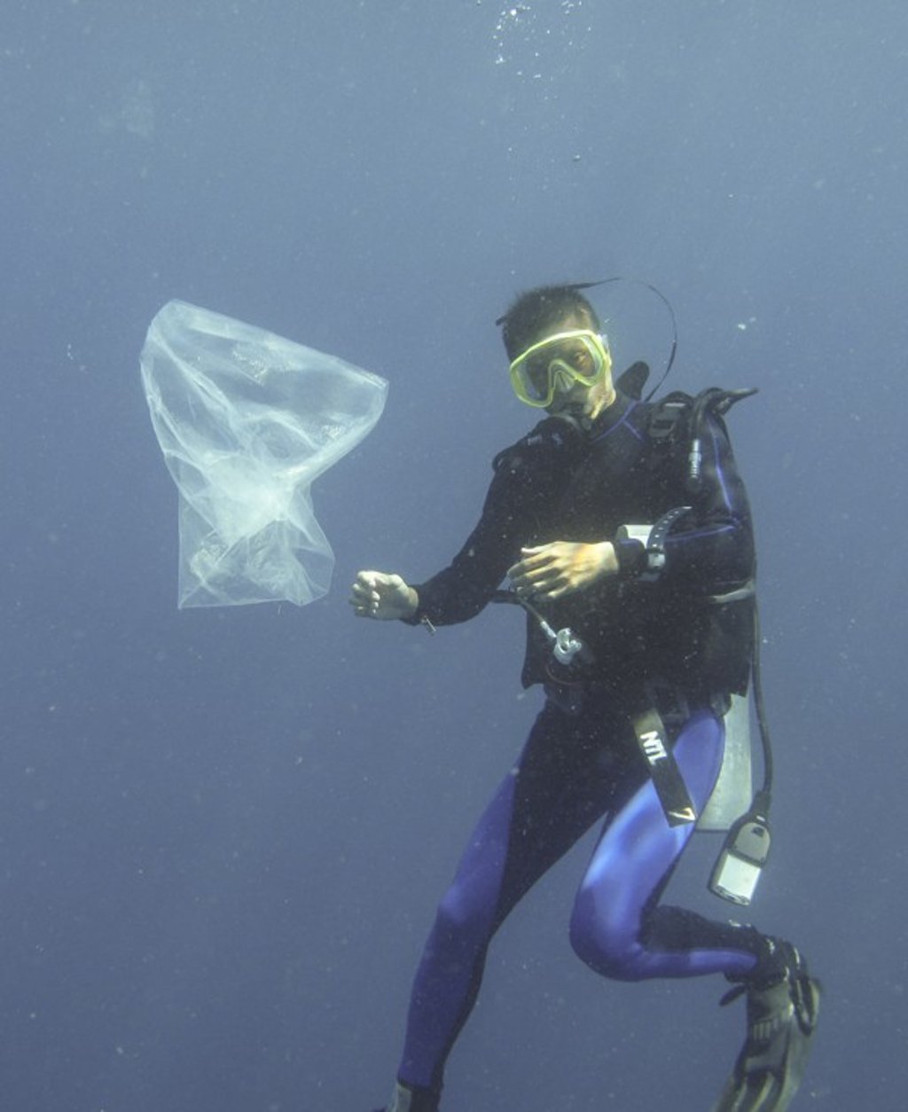 A diver next to a random plastic bag in the waters off Bali, Indonesia. Photo: Handout