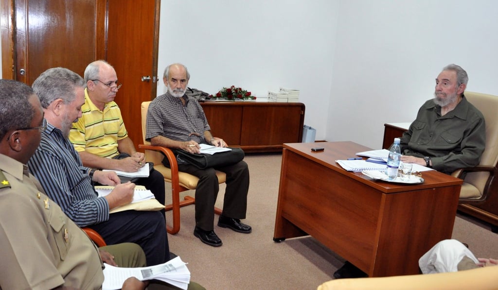 Former Cuban leader Fidel Castro (right) and his son Fidel Castro Diaz-Balart (second left) attend a meeting with others, in Havana in 2010. Photo: Reuters