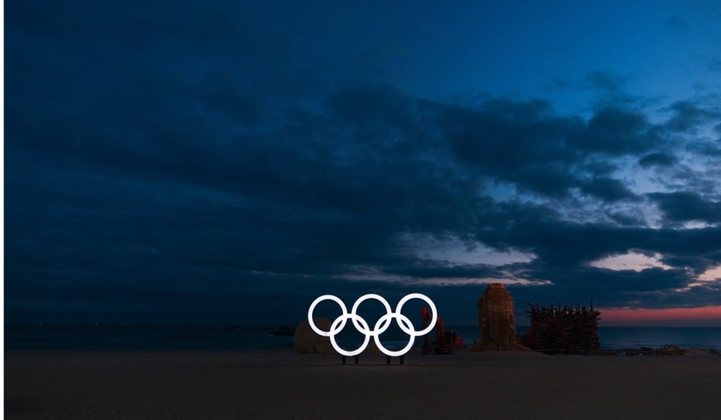 The Olympic rings stand on the beach next to art installations before sunrise before the 2018 Winter Olympics in Gangneung, South Korea. Photo: AP