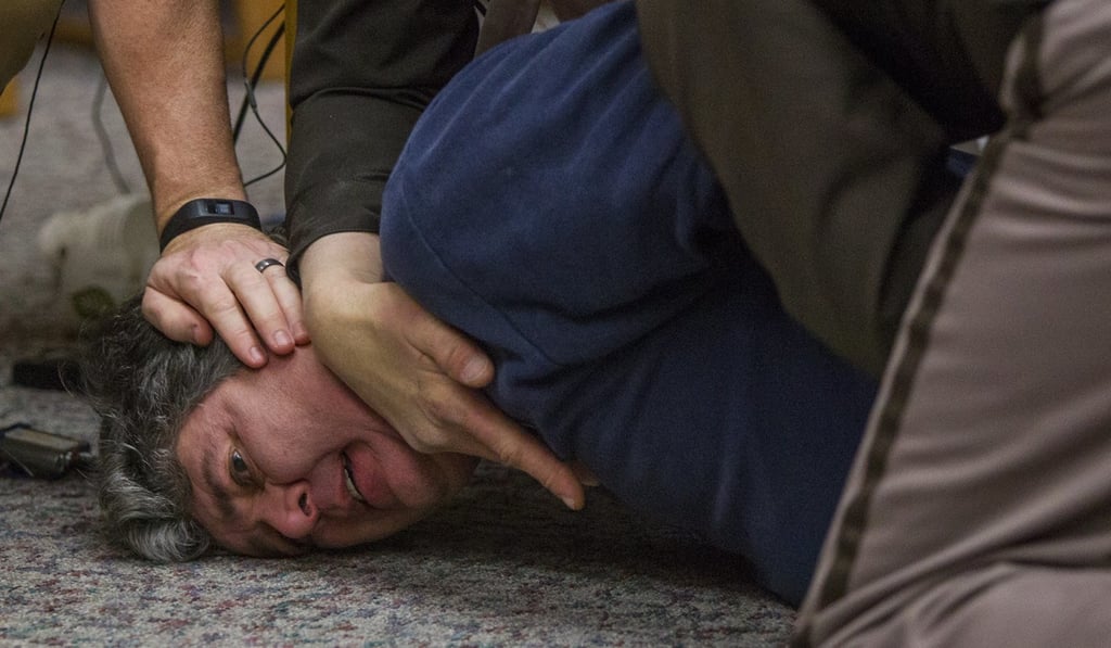 Margraves had asked the judge for ‘five minutes in a locked room’ with Nassar before making the attempt. He was escorted from the room and the hearing temporarily halted. Photo: The Grand Rapids Press via AP