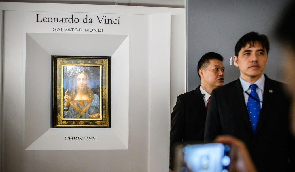 Jerry Chun Shing Lee, right, during his work for Christie’s in Hong Kong. Photo: AFP