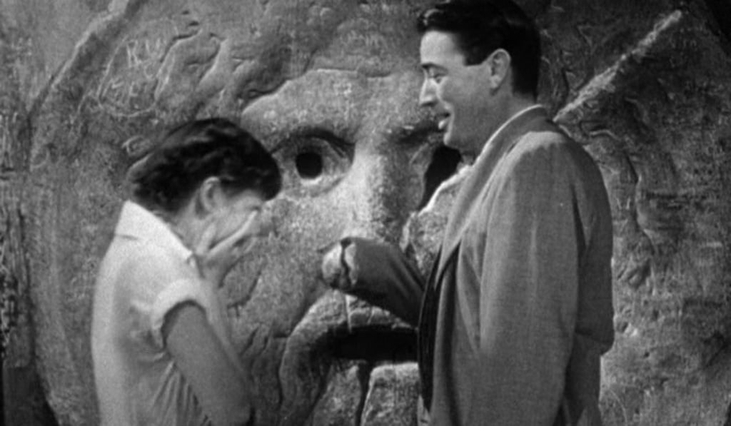 Joe teases Ann at the Mouth of Truth in Roman Holiday. Joe teases Ann at the Mouth of Truth in Roman Holiday.