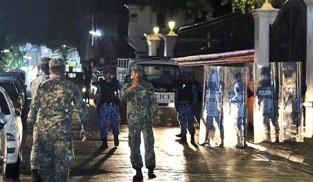 Maldives soldiers patrol the main street of the capital Male on Monday after the government has declared a 15-day state of emergency. Photo: AP Maldives soldiers patrol the main street of the capital Male on Monday after the government has declared a 15-day state of emergency. Photo: AP