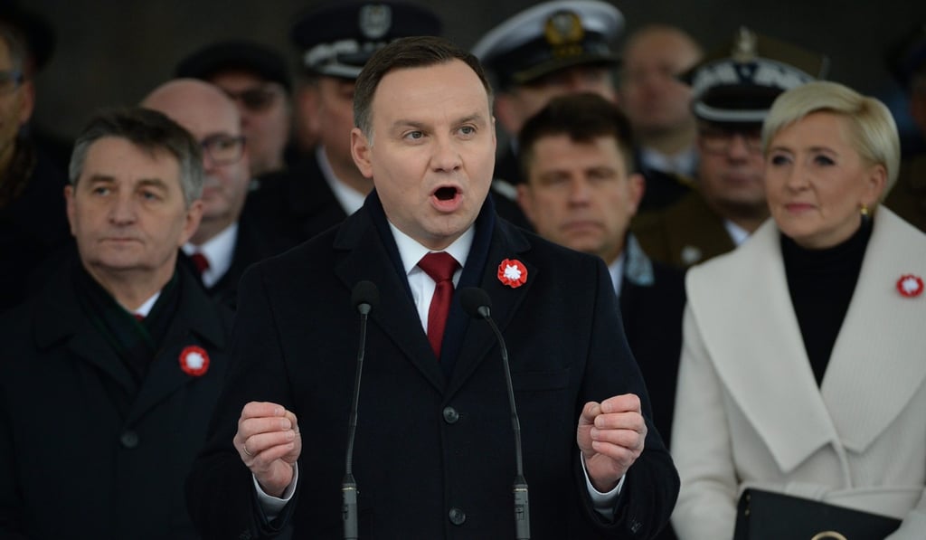 President of Poland Andrzej Duda speaks at a ceremony at the Tomb of the Unknown Soldier in Warsaw in November 2016. Duda has not yet signed the Law on Institute of National Memory even though it was passed by the ruling party of which he is a member. Photo: EPA