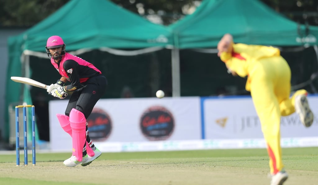 Nizakat Khan (left) bats against City Kaitak at Mission Road. Photo: Winson Wong