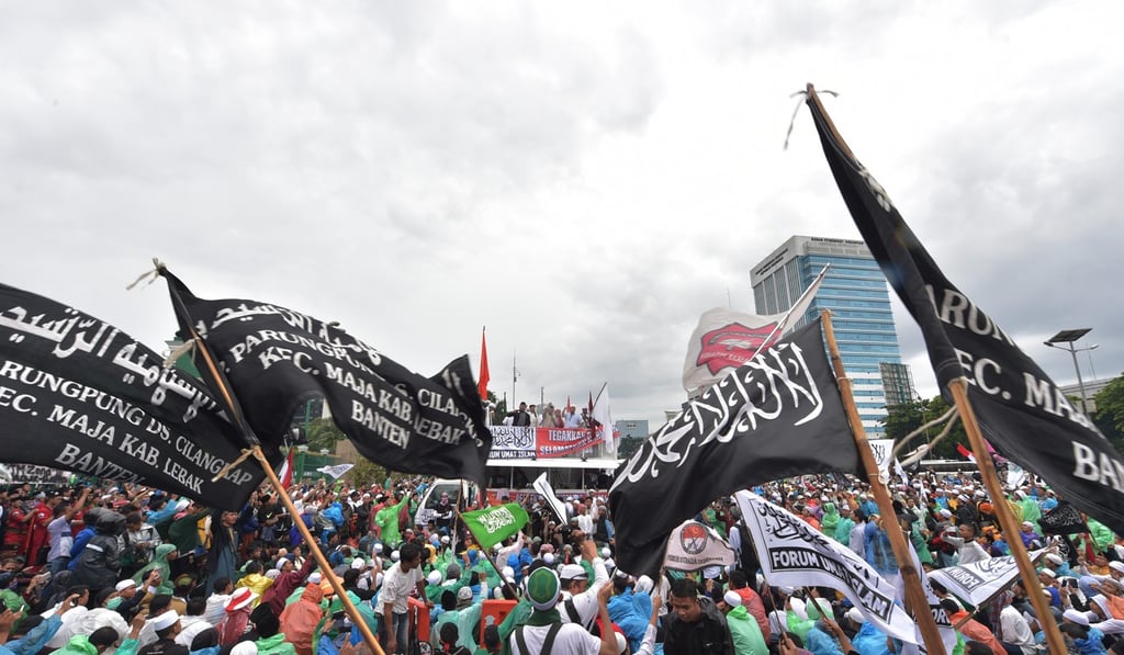 Demonstrators protest against Jakarta’s Christian governor Basuki Tjahaja Purnama, also known as Ahok, who stood trial for blasphemy, in February 2017. Photo: AFP