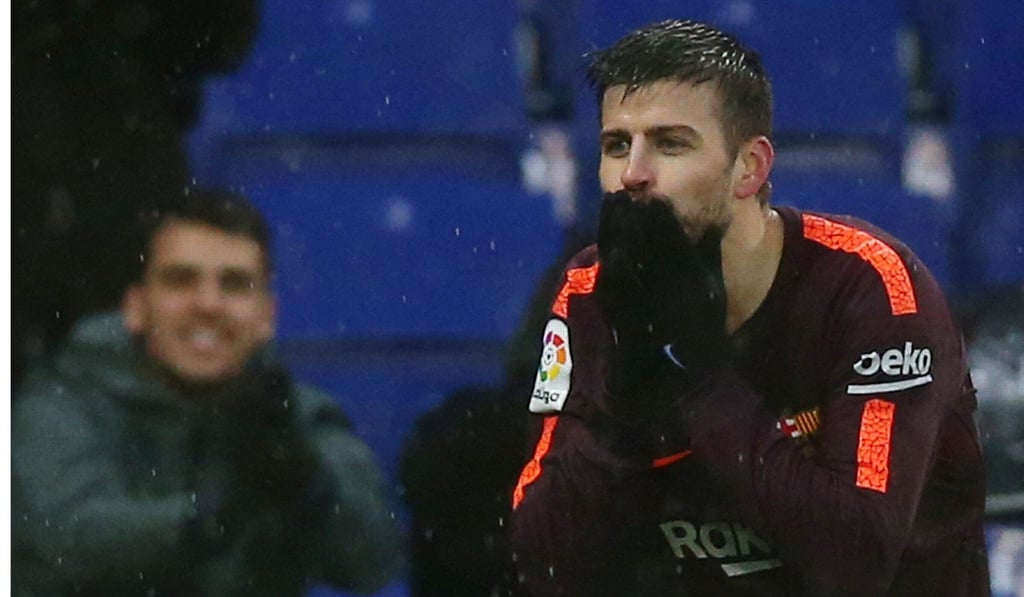 Pique reacted after scoring Barcelona’s equaliser. Photo: Reuters