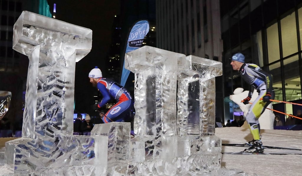 Skiers pass by an ice sculpture of the Roman numeral LII for Super Bowl 52 on a ski run in downtown Minneapolis, Minnesota. Photo: AP Skiers pass by an ice sculpture of the Roman numeral LII for Super Bowl 52 on a ski run in downtown Minneapolis, Minnesota. Photo: AP