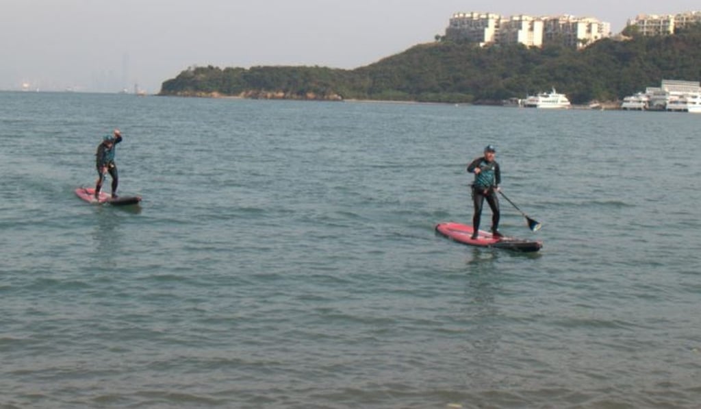 Tim Tait and Jonny Haines approach the beach after 99km of paddling.